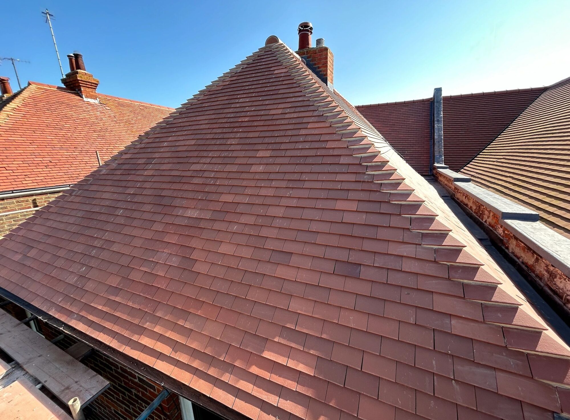Traditional clay tile hip roof completed by Nathan & Co in Sussex